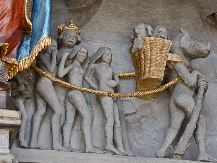 Le diable entraînant après lui et dans sa hotte de bien tristes sires. Portail de la cathédrale Saint Nicolas de Fribourg, XVe siècle, Suisse © Alain Michot 