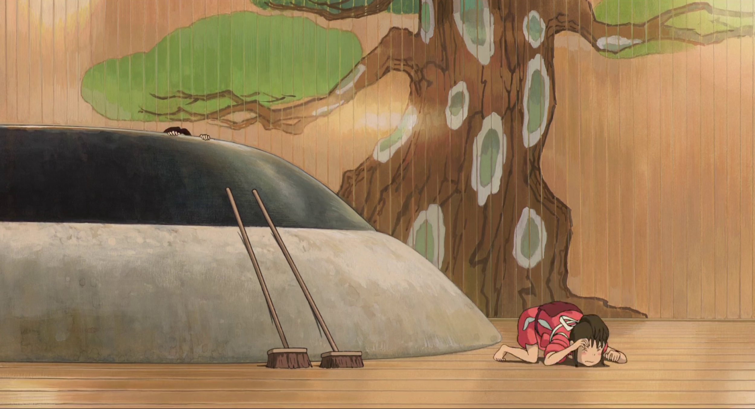 Chihiro devenue Sen a pour tache de nettoyer les bains des esprits. Le Voyage de Chihiro, Hayao Miyazaki, 2001